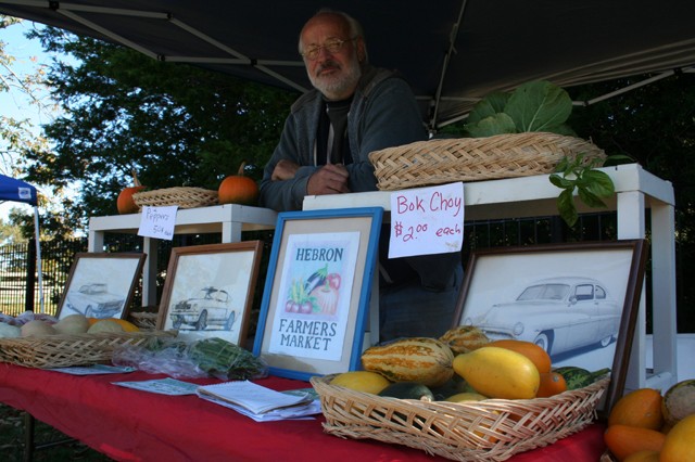 Welcome to Hebron Farmers Market. Rick Gorden is an artist and gardener at the Hebron Farmers Market. Gorden created the colorful art for the market and also offers detailed drawings of classic cars and seasonal produce.
