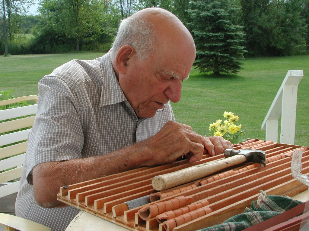 Richmond "Twinny" Castano, co-founder of Twin Leather, makes toys for the birds.